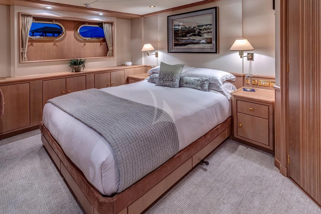 a bed with a white comforter aboard CHANTAL MA VIE Yacht for Sale