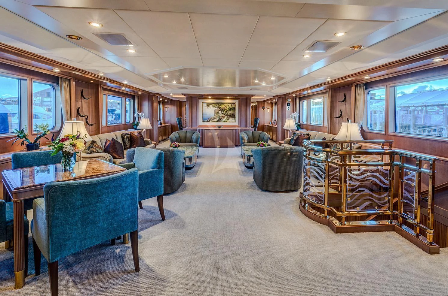 a large living room with a large table and chairs aboard CHANTAL MA VIE Yacht for Sale