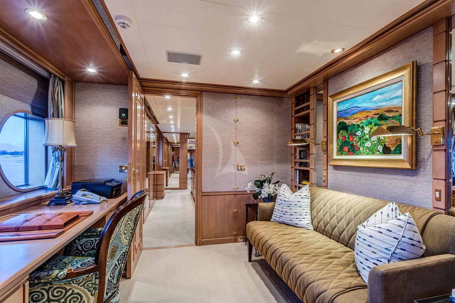 a living room with a couch and a table aboard CHANTAL MA VIE Yacht for Sale