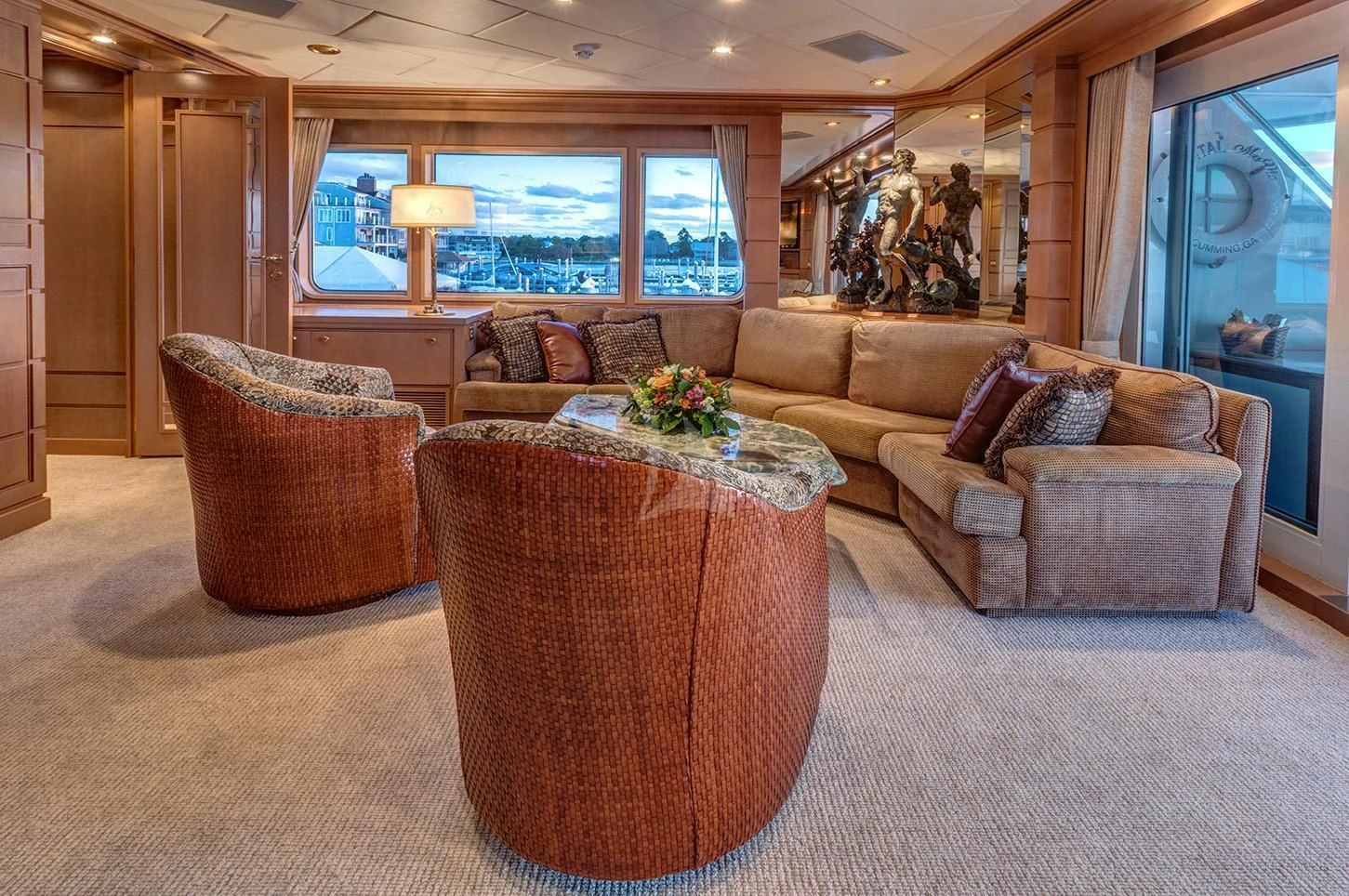 a living room with a couch and a table aboard CHANTAL MA VIE Yacht for Sale
