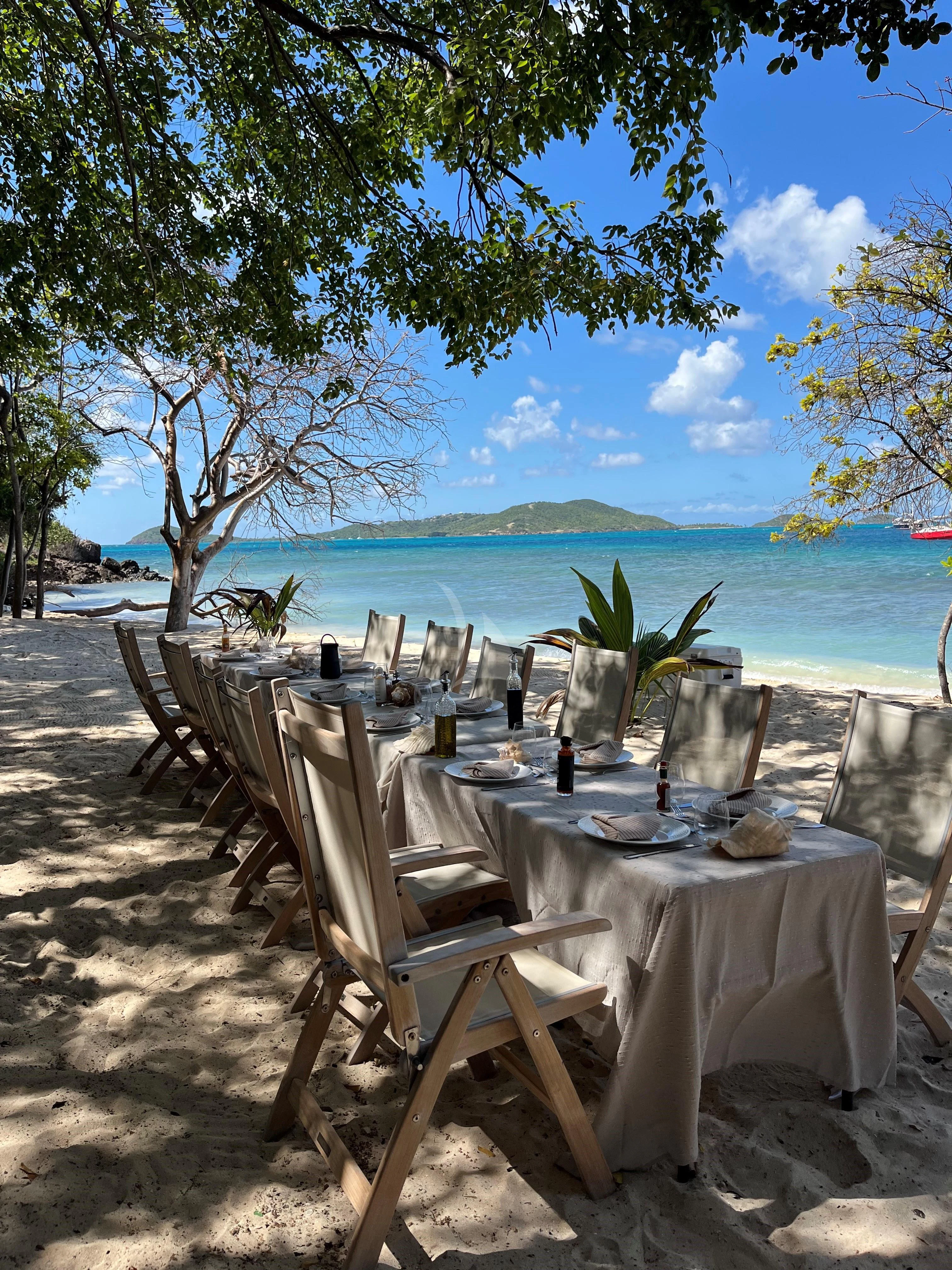 a table set for a dinner aboard CHANTAL MA VIE Yacht for Sale