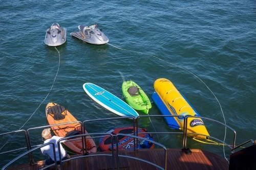 a boat with surfboards on it aboard CHANTAL MA VIE Yacht for Sale