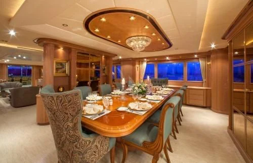 a large dining room with a table and chairs aboard CHANTAL MA VIE Yacht for Sale