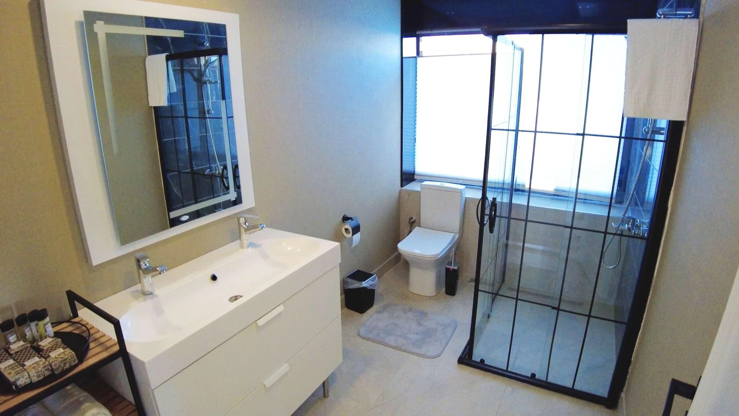 a bathroom with a large mirror aboard LIMITLESS Yacht for Charter