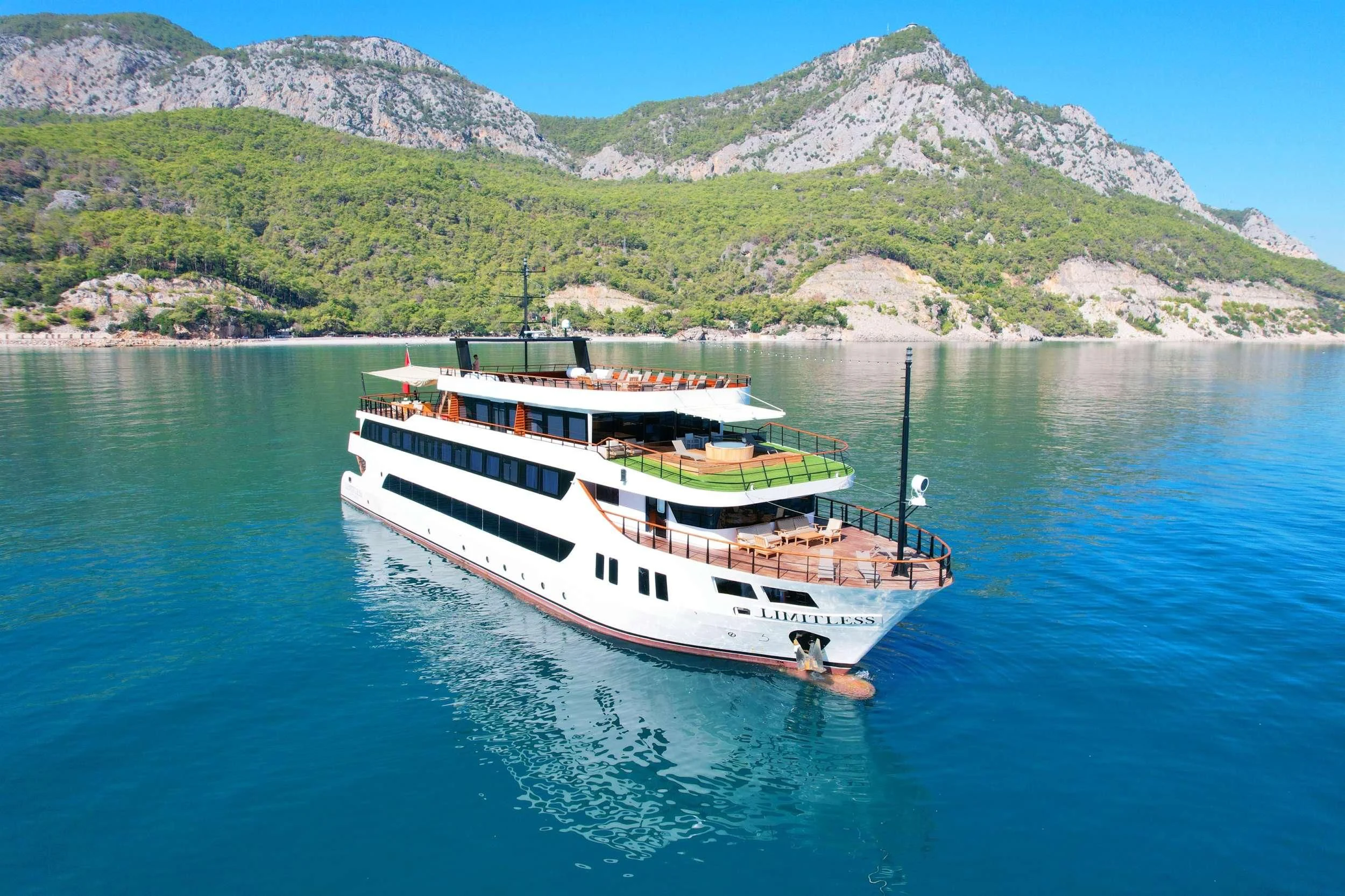 a boat on the water aboard LIMITLESS Yacht for Charter
