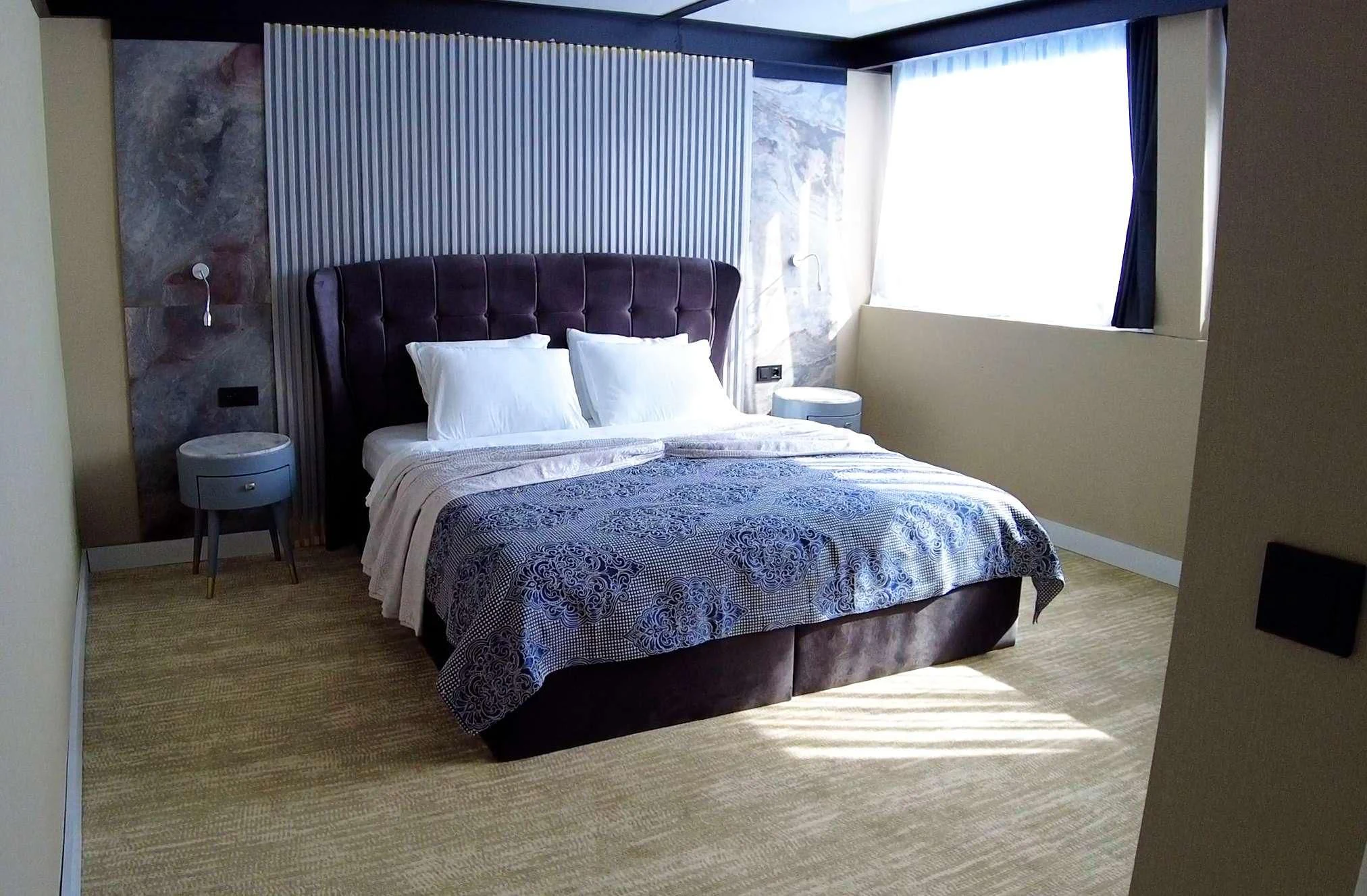 a couple of beds in a room aboard LIMITLESS Yacht for Charter