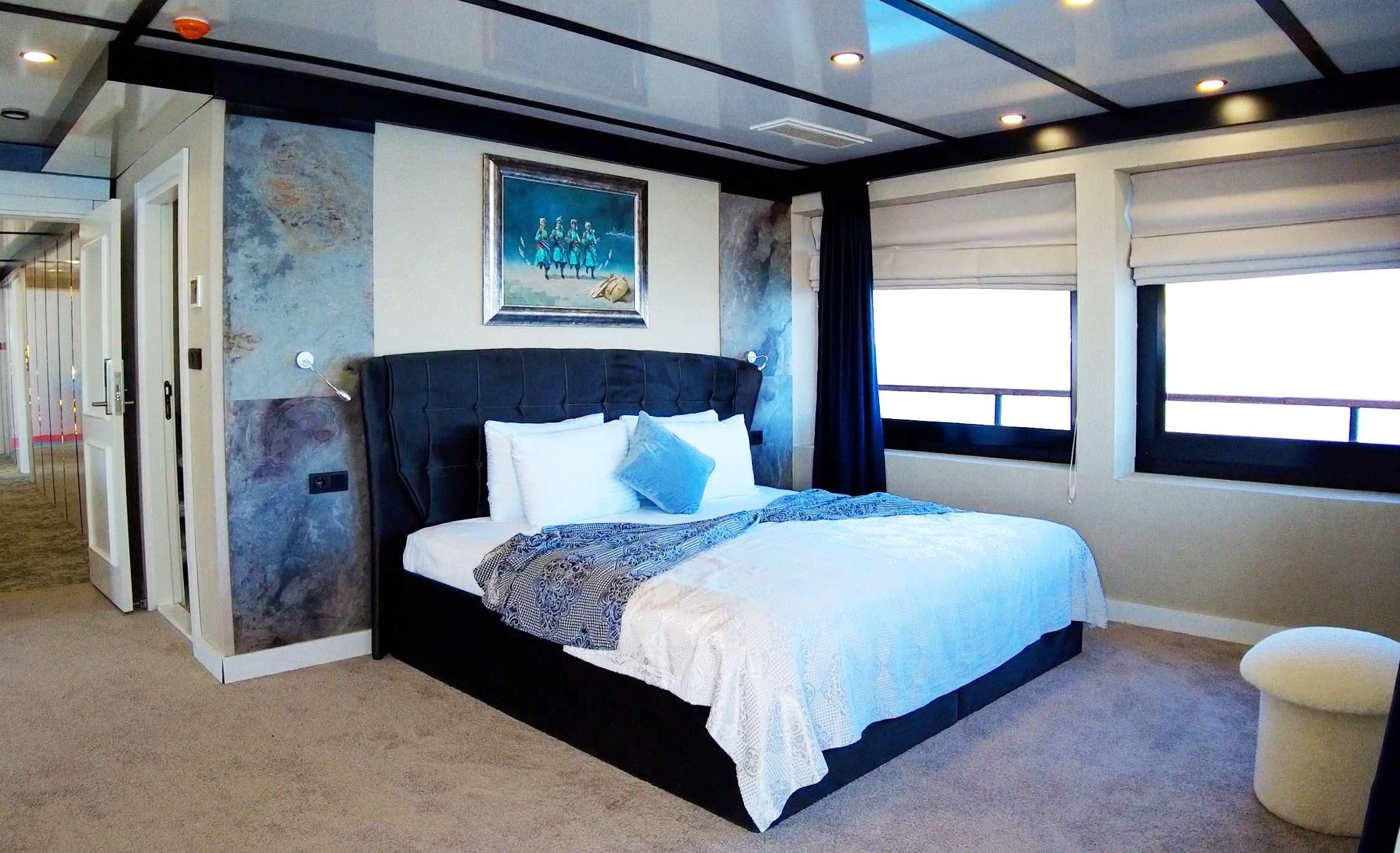 a bed in a room aboard LIMITLESS Yacht for Charter