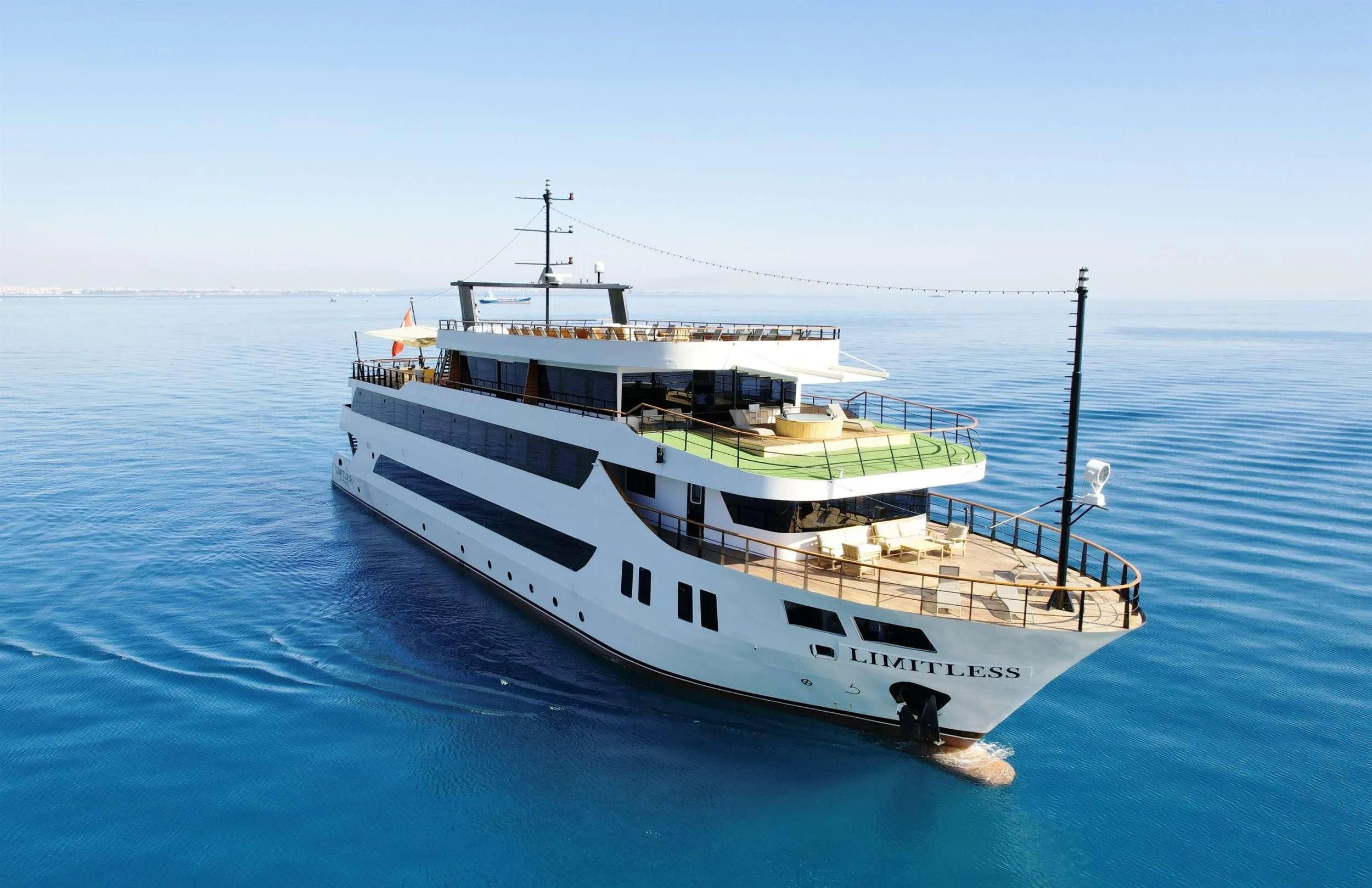 a boat on the water aboard LIMITLESS Yacht for Charter