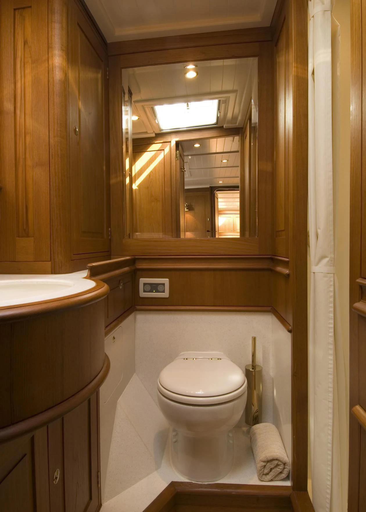 a bathroom with a toilet and a sink aboard VELACARINA Yacht for Sale