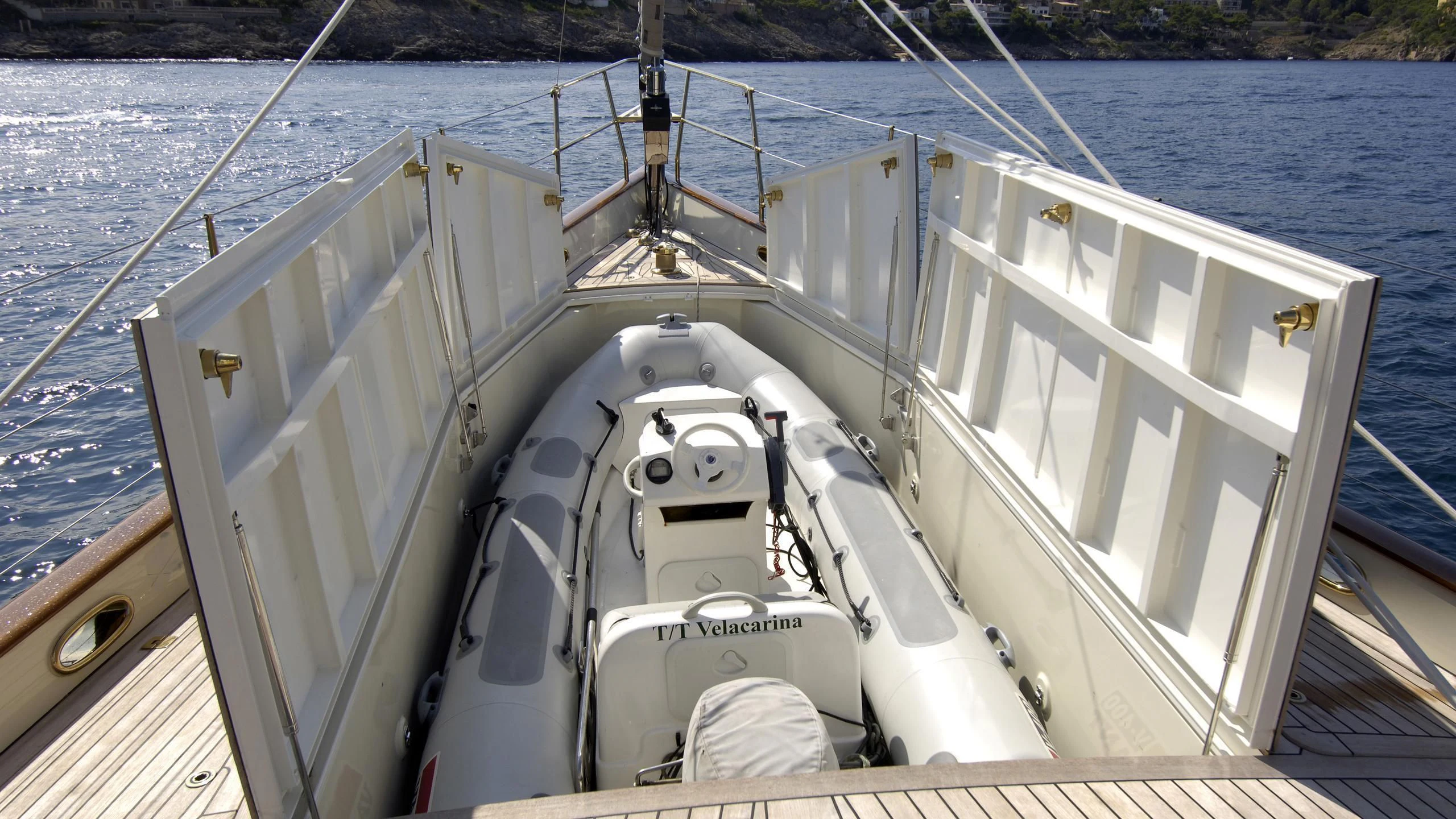 a large white boat on a body of water aboard VELACARINA Yacht for Sale