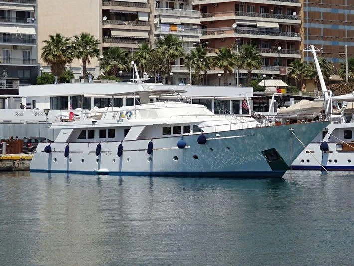 a couple of boats in a harbor aboard IOVY Yacht for Sale