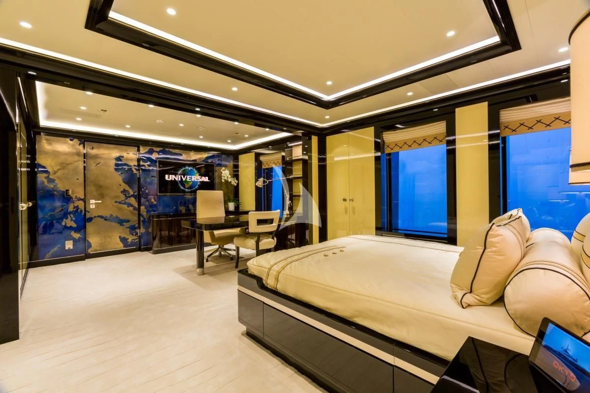 a room with a bed and a desk aboard OKTO Yacht for Charter