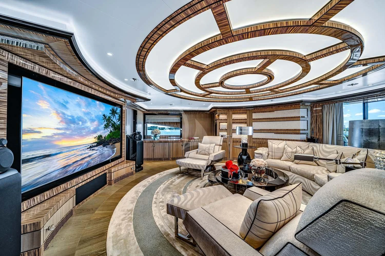 a living room with a large chandelier aboard OKTO Yacht for Charter