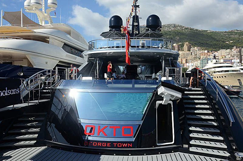 a boat docked at a pier aboard OKTO Yacht for Charter