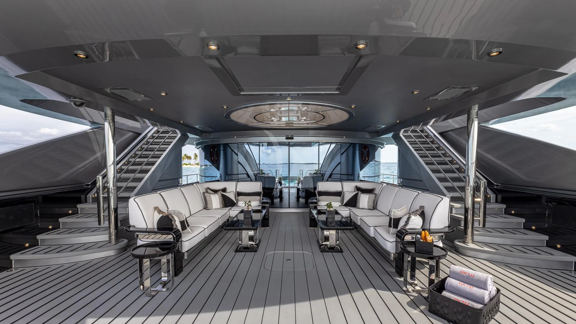 a room with a large window and a staircase aboard OKTO Yacht for Charter