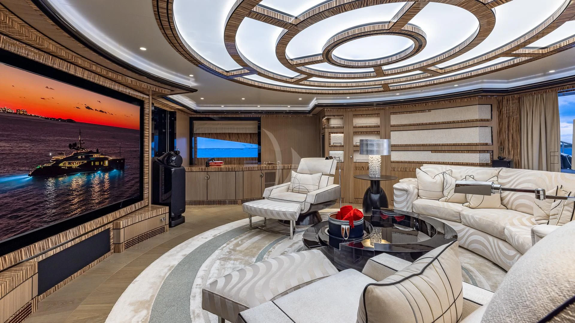 a living room with a large fireplace aboard OKTO Yacht for Charter