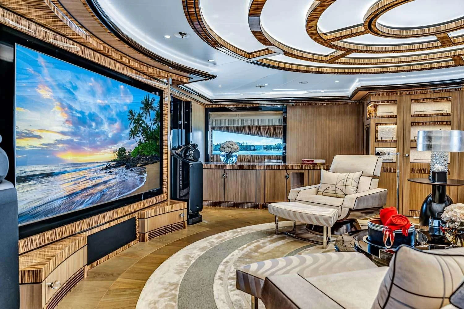 a large living room with a large screen aboard OKTO Yacht for Charter