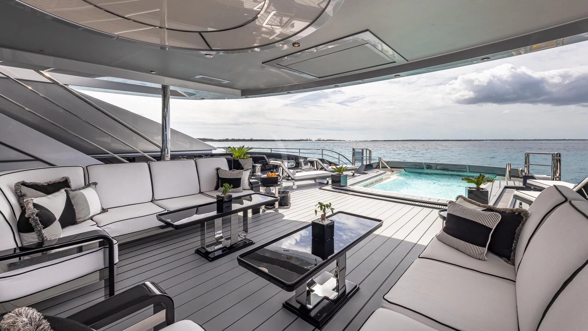 a room with a pool and a couch aboard OKTO Yacht for Charter