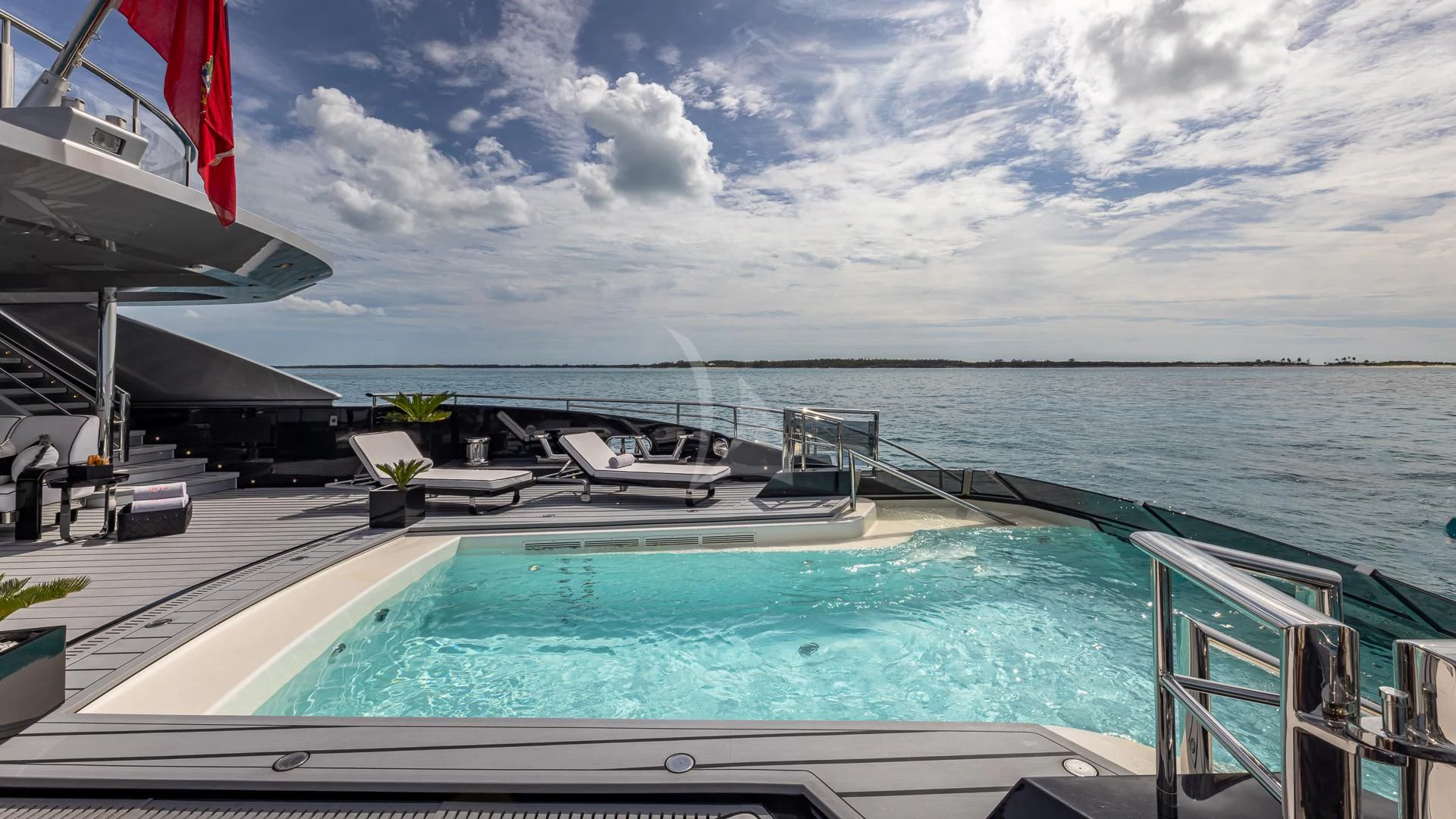 a pool next to a deck aboard OKTO Yacht for Charter