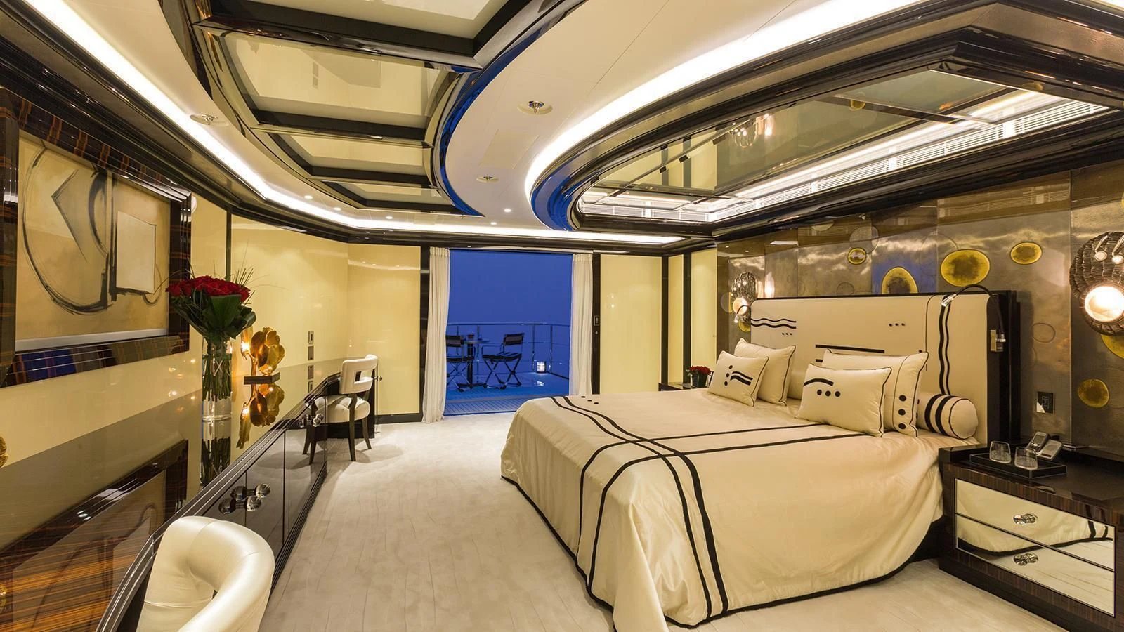 a room with a bed and a mirror aboard OKTO Yacht for Charter