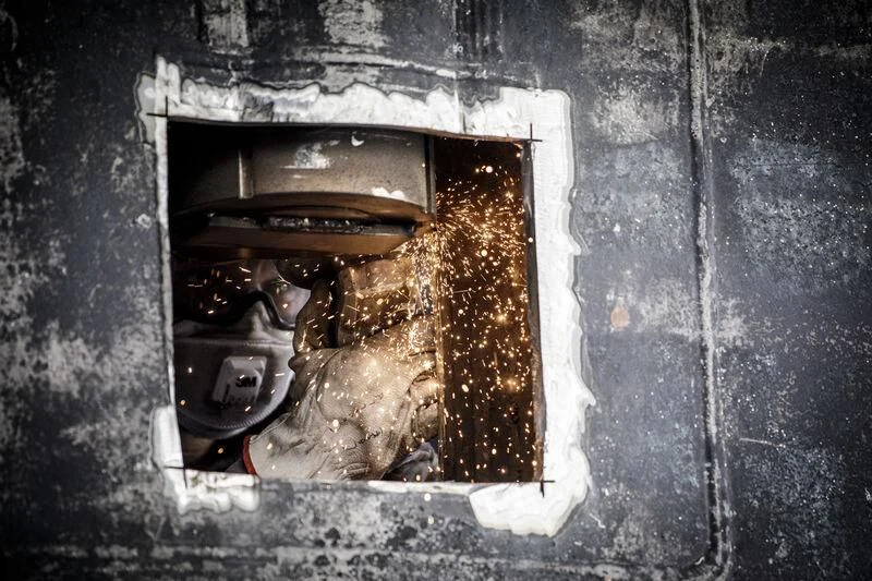 a broken window on a building aboard OKTO Yacht for Charter