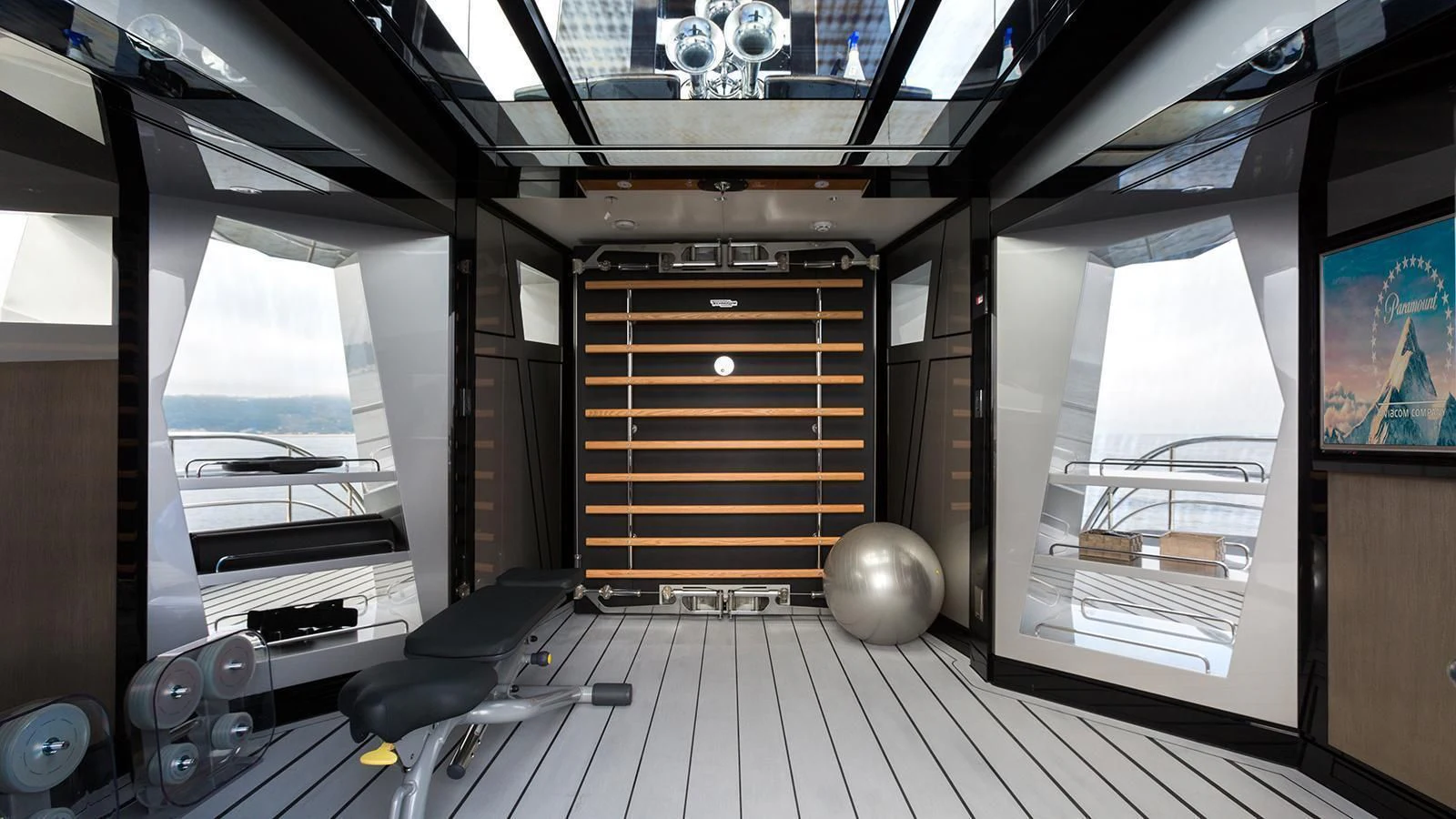 a room with a large window and a computer aboard OKTO Yacht for Charter