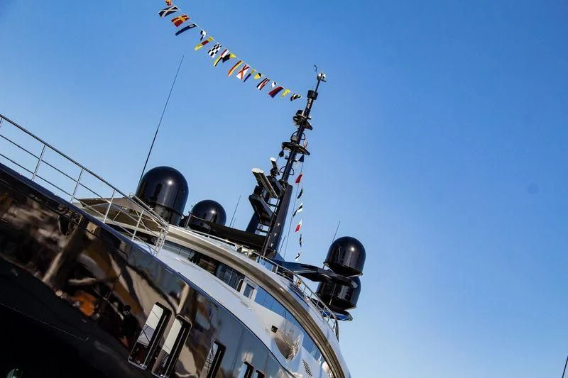 a large white ship with a blue sky aboard OKTO Yacht for Charter