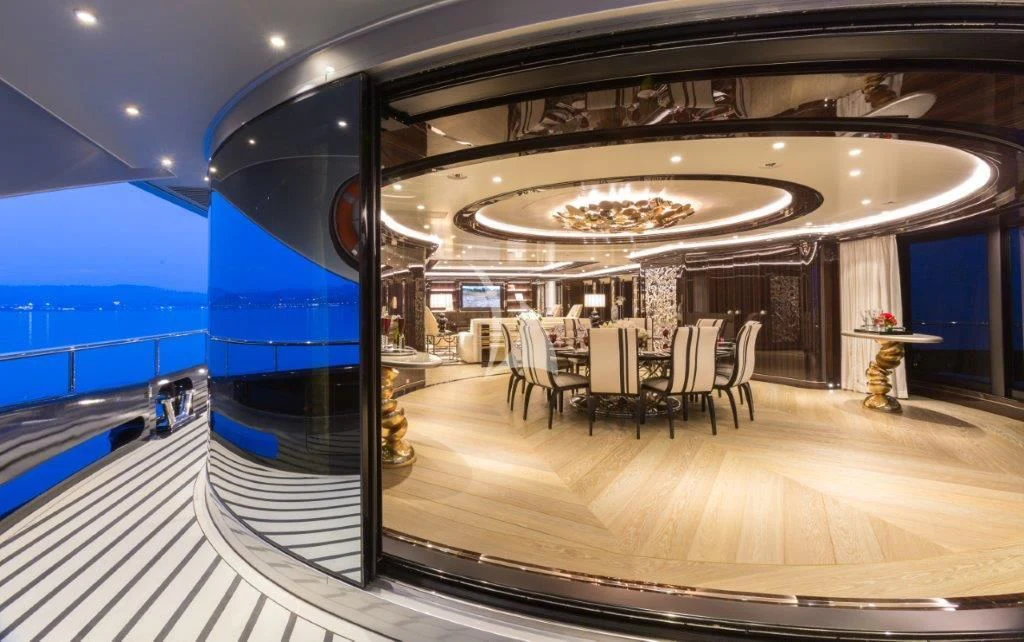 a room with a table and chairs aboard OKTO Yacht for Charter