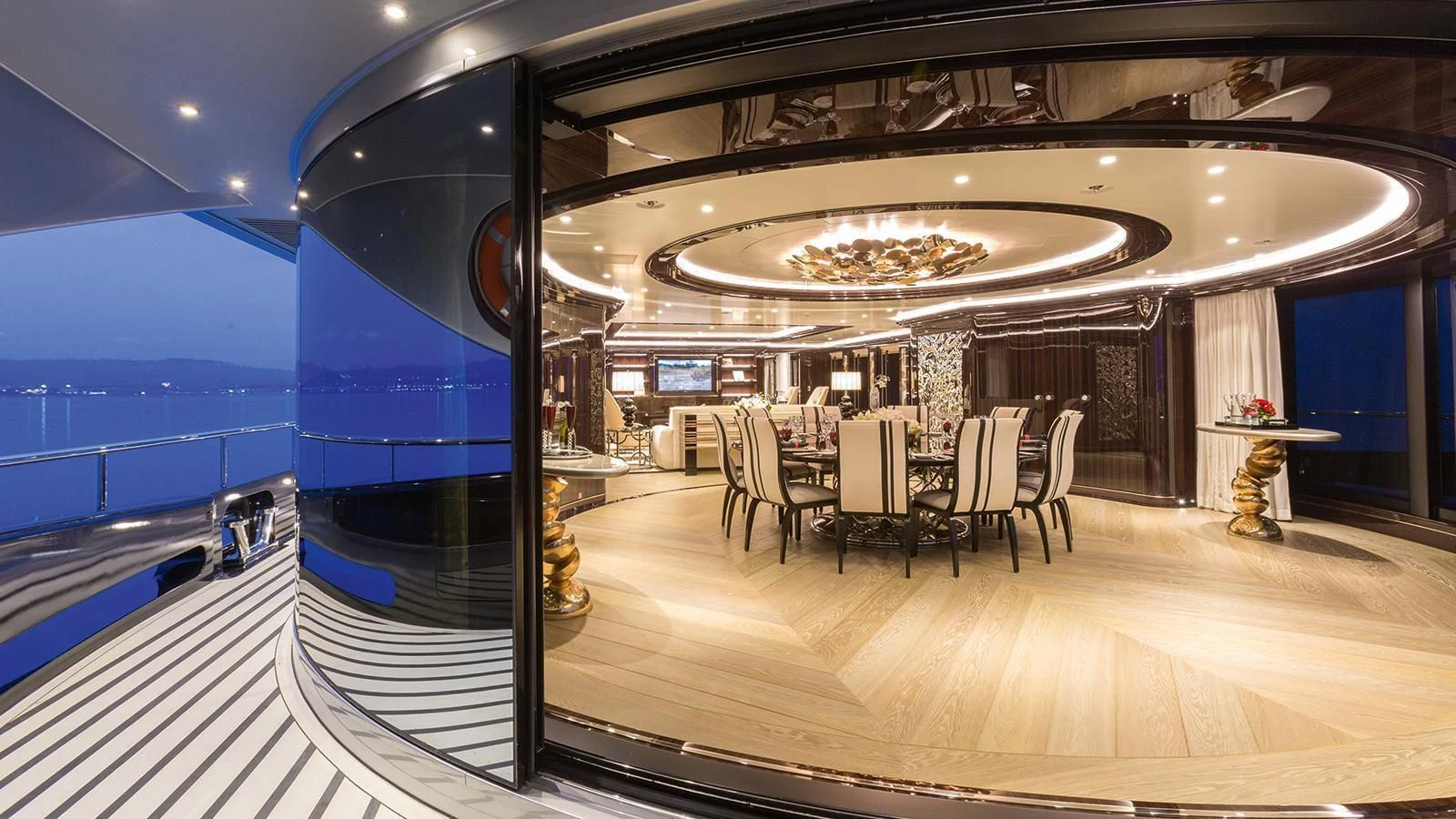 a room with a table and chairs aboard OKTO Yacht for Charter