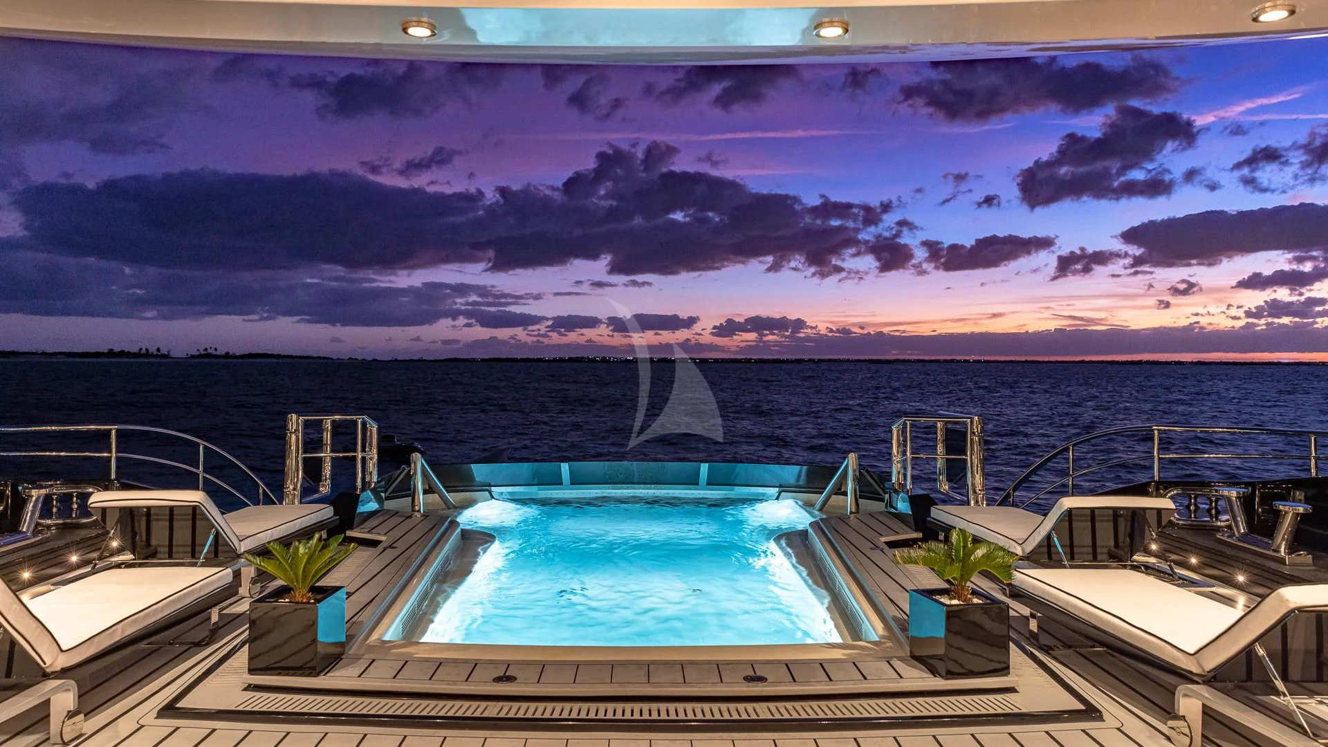 a pool with a view of a city and water aboard OKTO Yacht for Charter