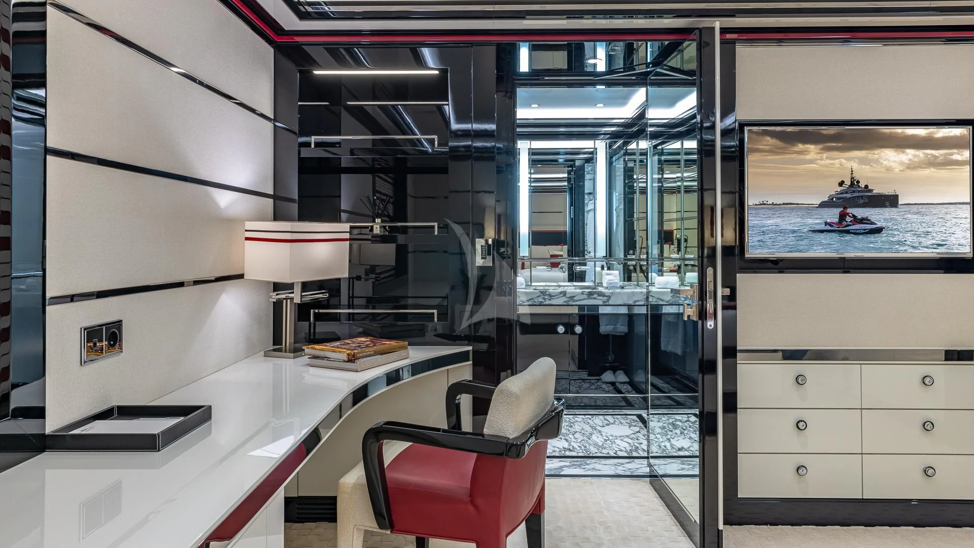 a room with a desk and chairs aboard OKTO Yacht for Charter