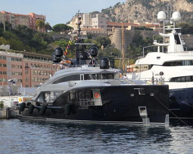 a boat docked at a pier aboard OKTO Yacht for Charter