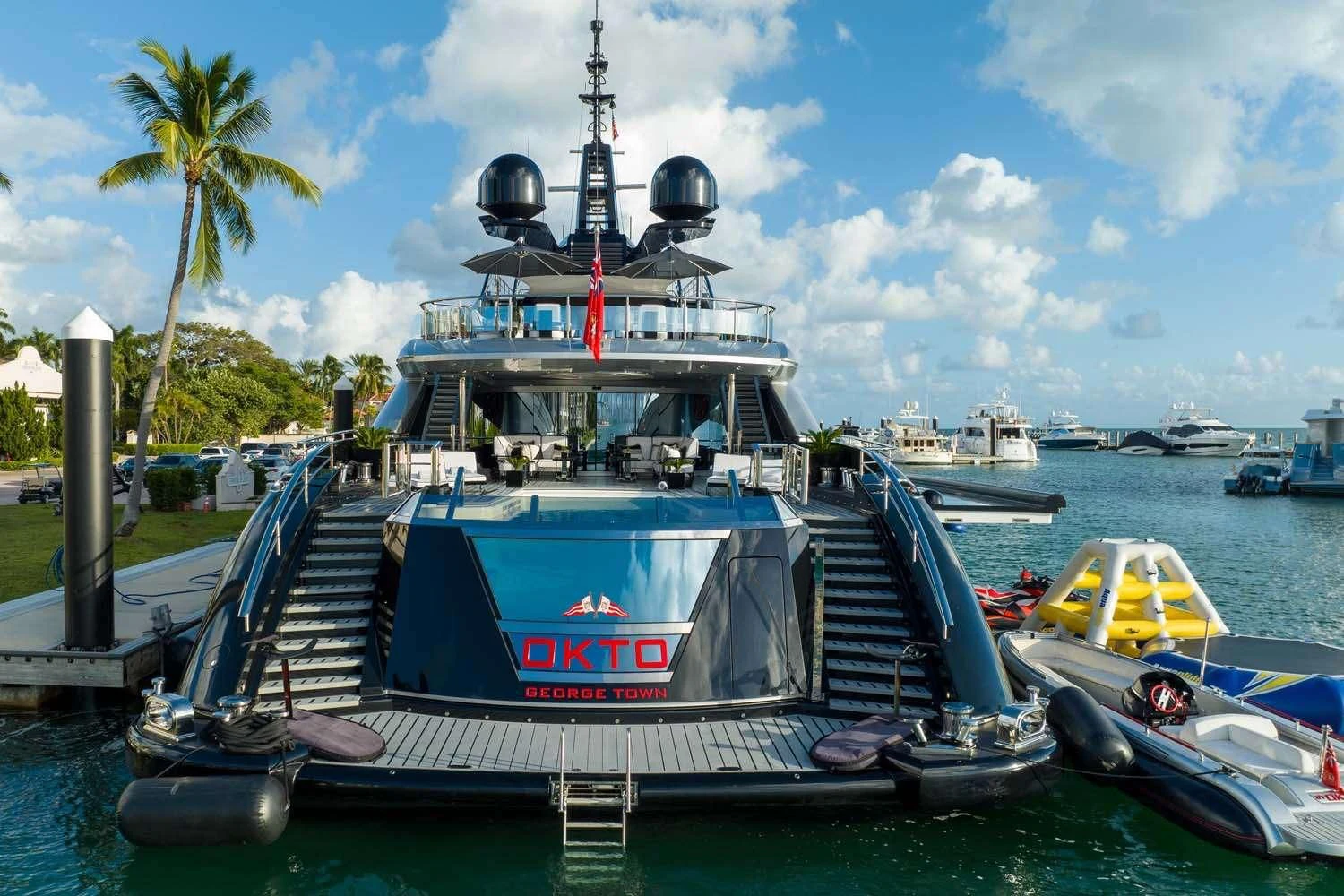 a boat docked at a pier aboard OKTO Yacht for Charter