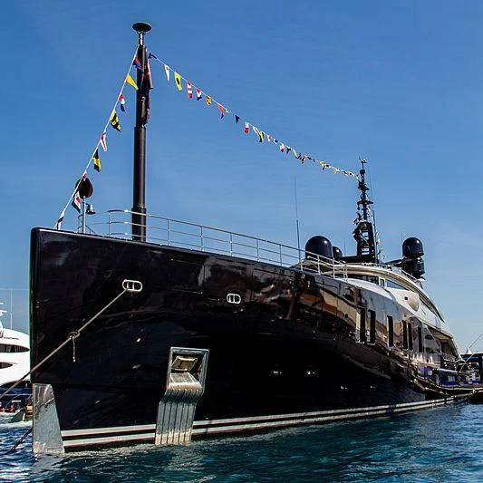 a large boat with flags aboard OKTO Yacht for Charter
