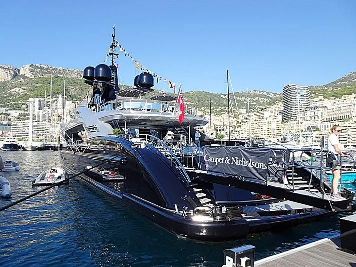 a large boat is parked on the dock aboard OKTO Yacht for Charter