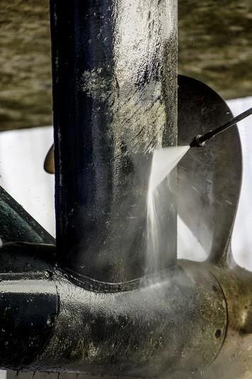 a black and white photo of a metal pipe with a black handle aboard OKTO Yacht for Charter
