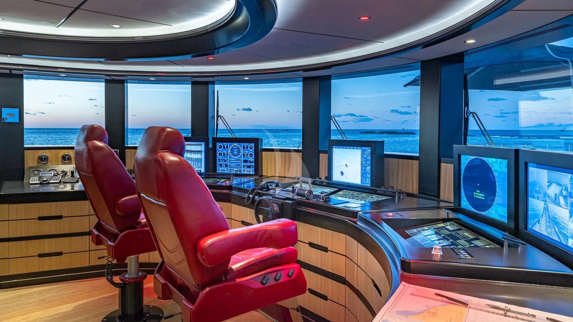 a room with computers and monitors aboard OKTO Yacht for Charter