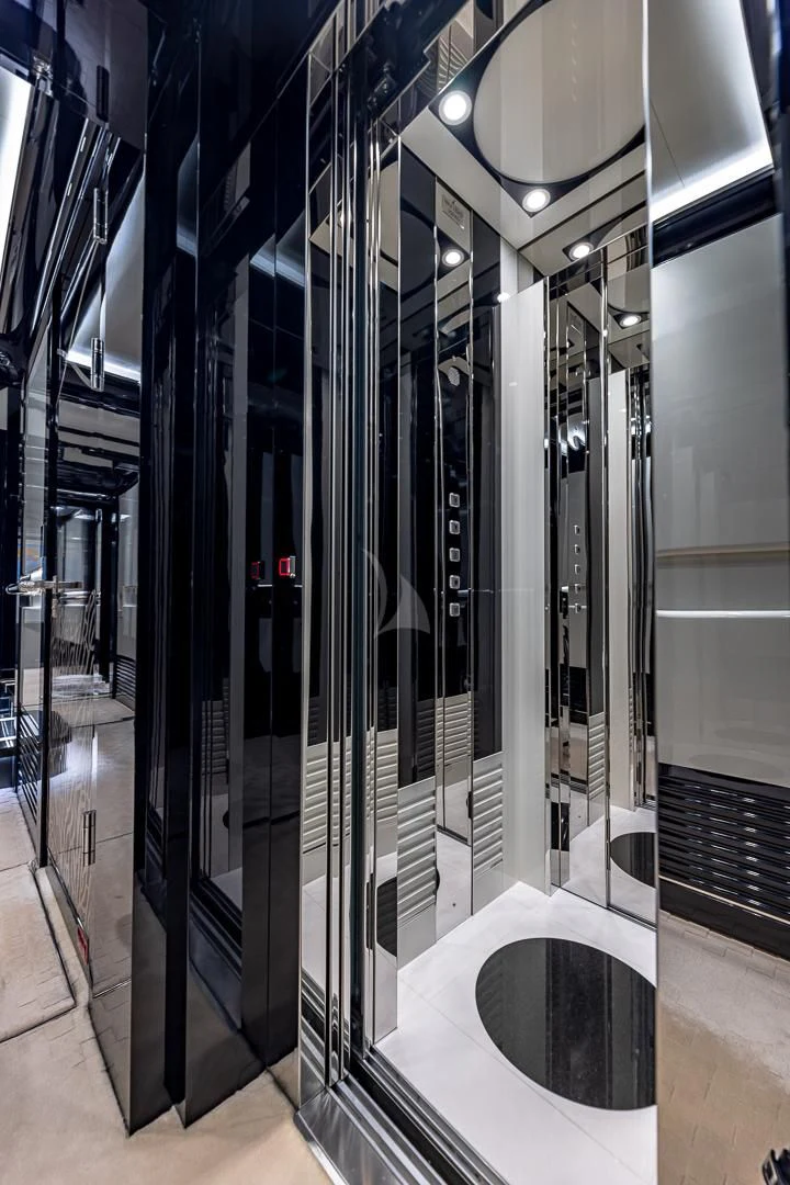 a large room with several servers aboard OKTO Yacht for Charter