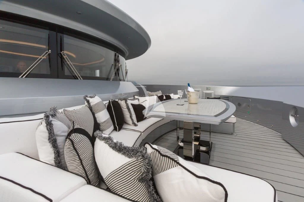 a car with a table and a bed aboard OKTO Yacht for Charter