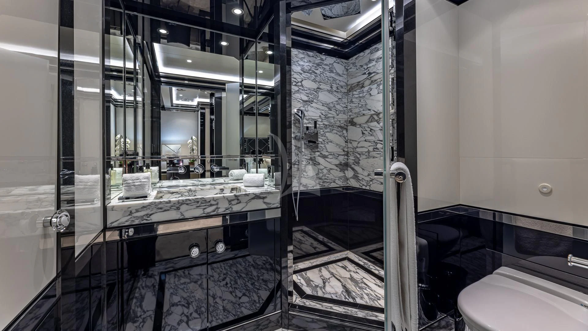 a bathroom with a tub sink and mirror aboard OKTO Yacht for Charter