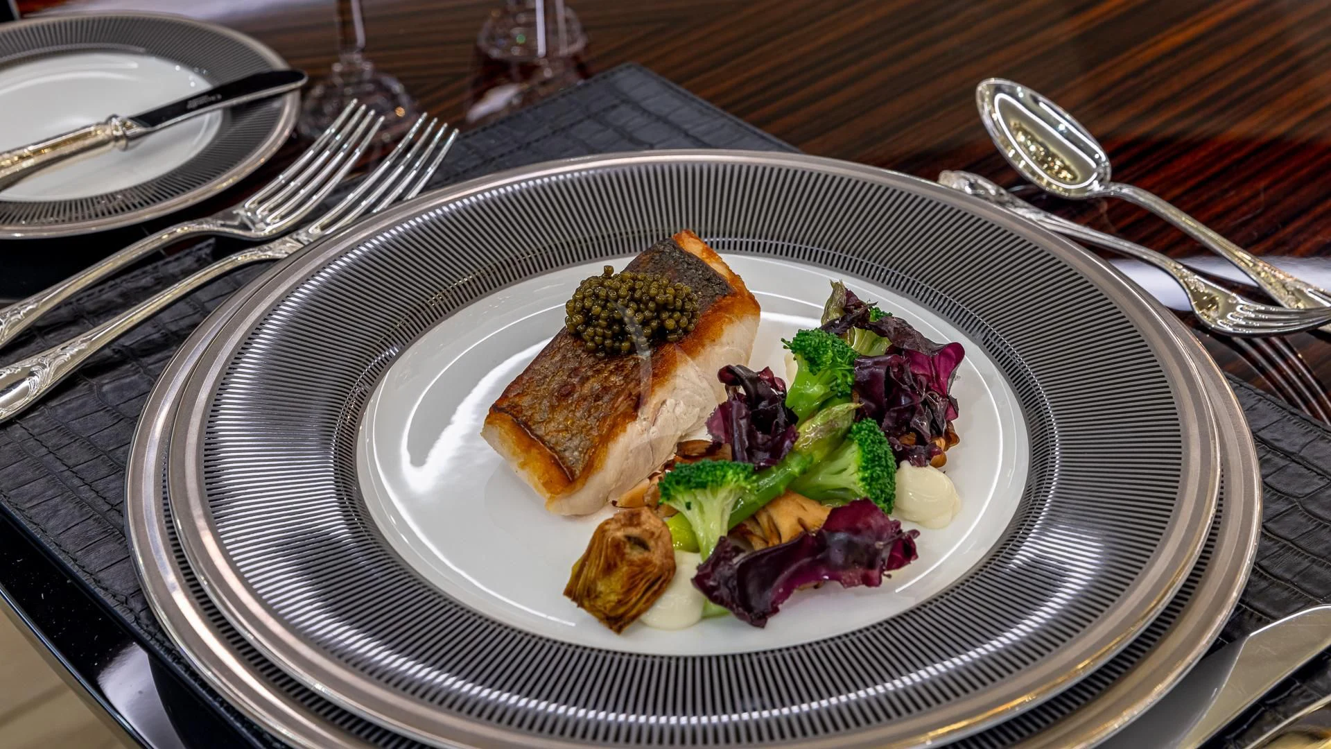 a plate of food aboard OKTO Yacht for Charter