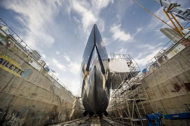 a ship docked at a port aboard OKTO Yacht for Charter