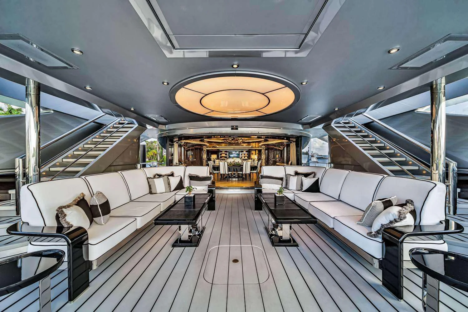 a large room with a couch and a table aboard OKTO Yacht for Charter
