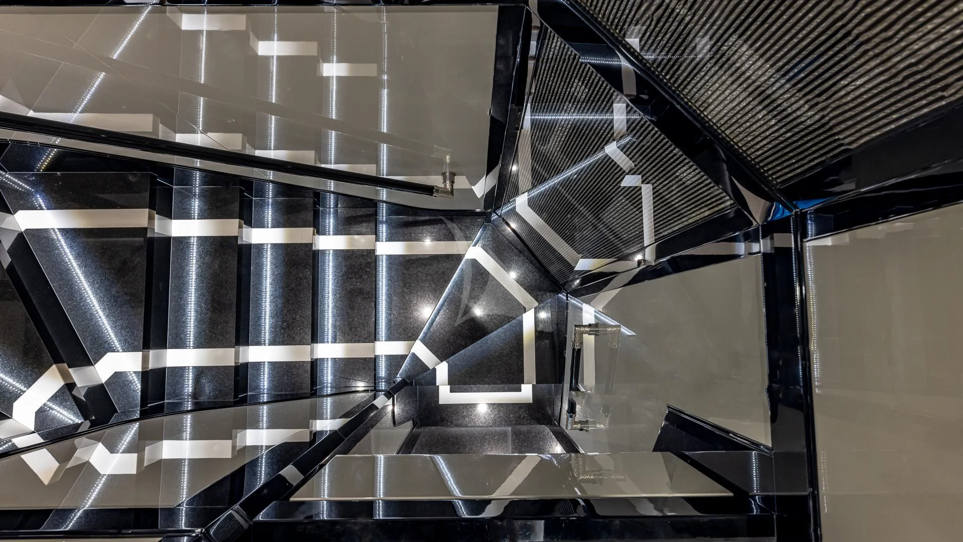 a metal staircase with a metal railing aboard OKTO Yacht for Charter