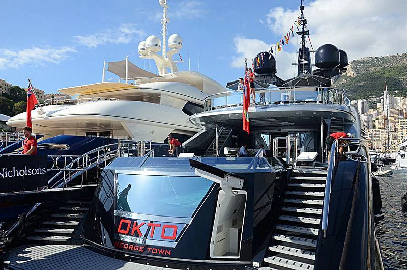 a boat docked at a port aboard OKTO Yacht for Charter
