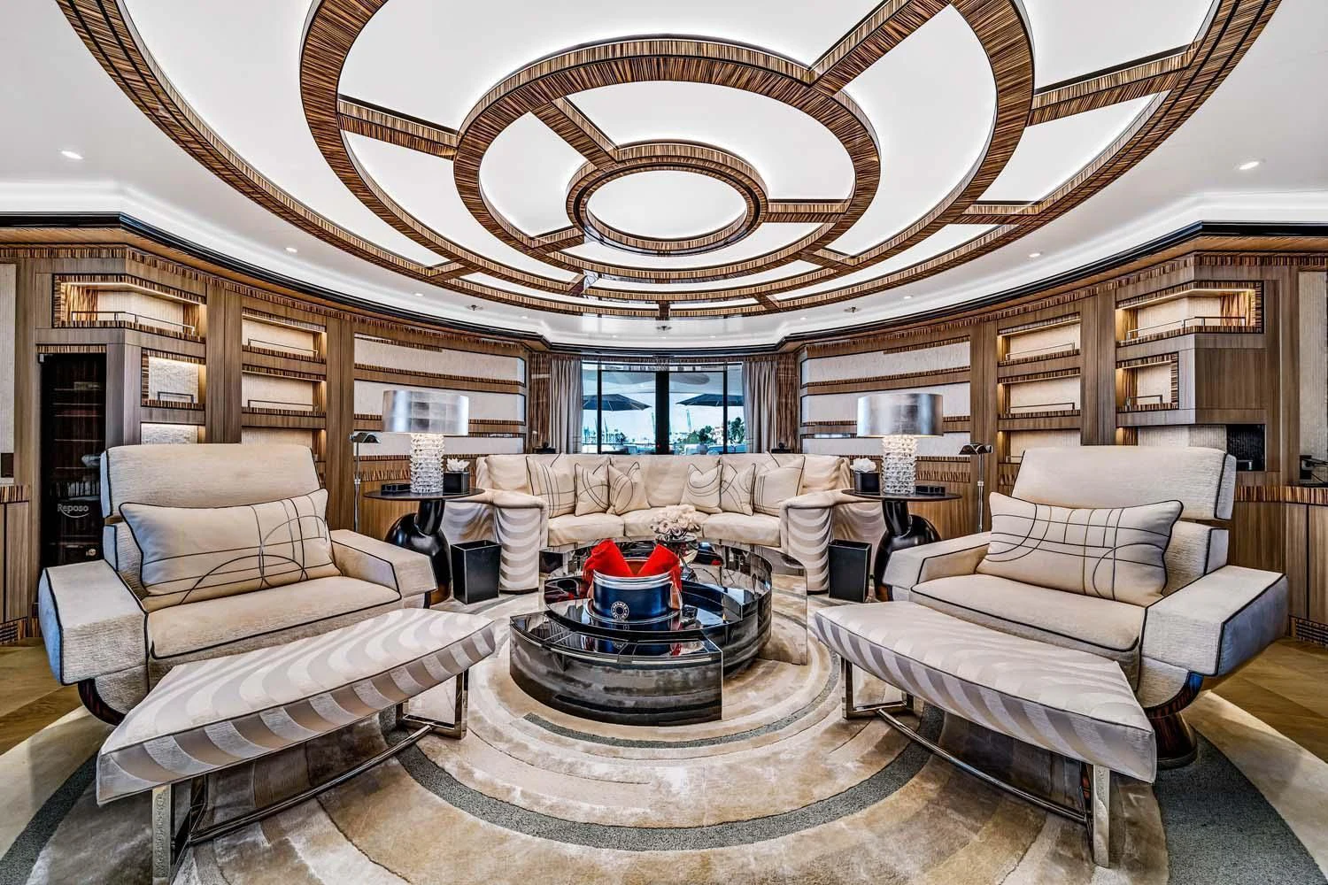 a living room with a chandelier aboard OKTO Yacht for Charter