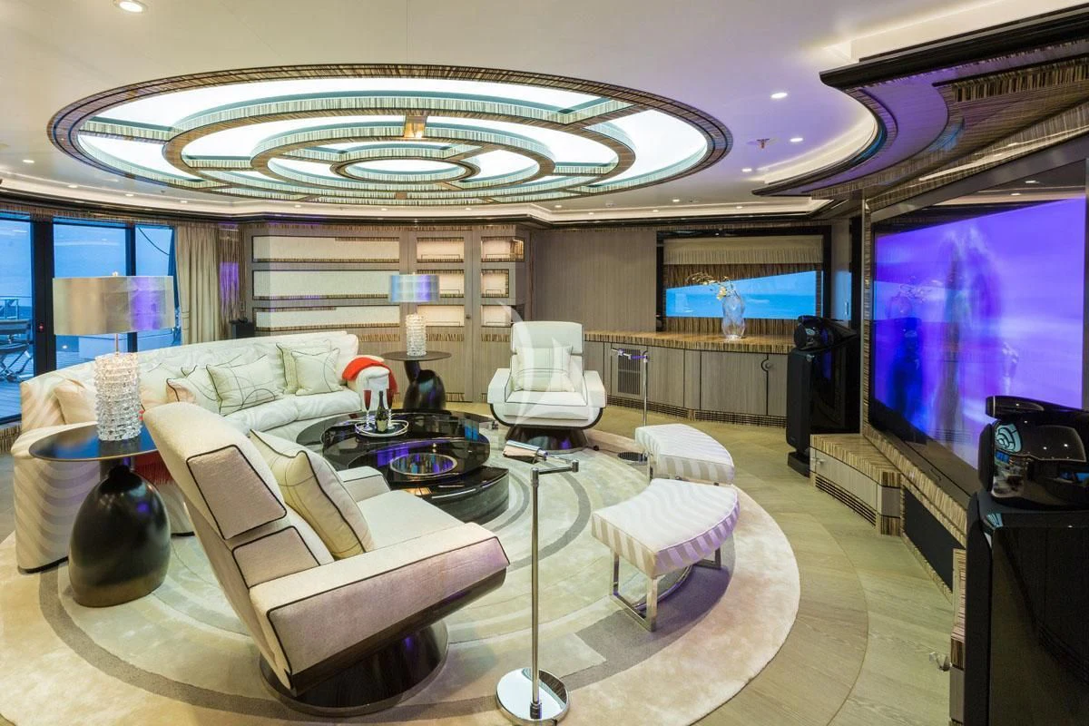 a large living room with a large screen aboard OKTO Yacht for Charter