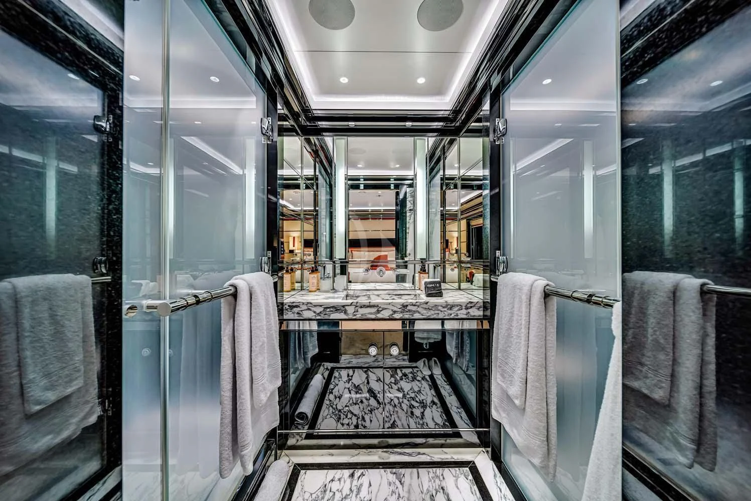 a bathroom with a large mirror aboard OKTO Yacht for Charter