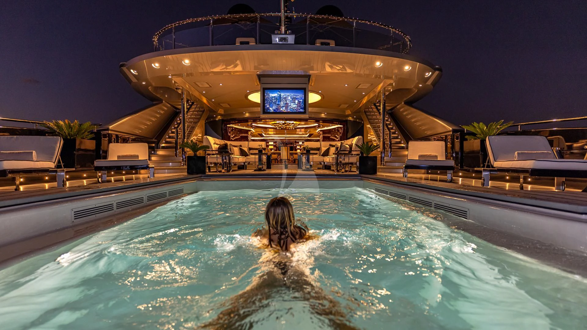 a person in a pool aboard OKTO Yacht for Charter