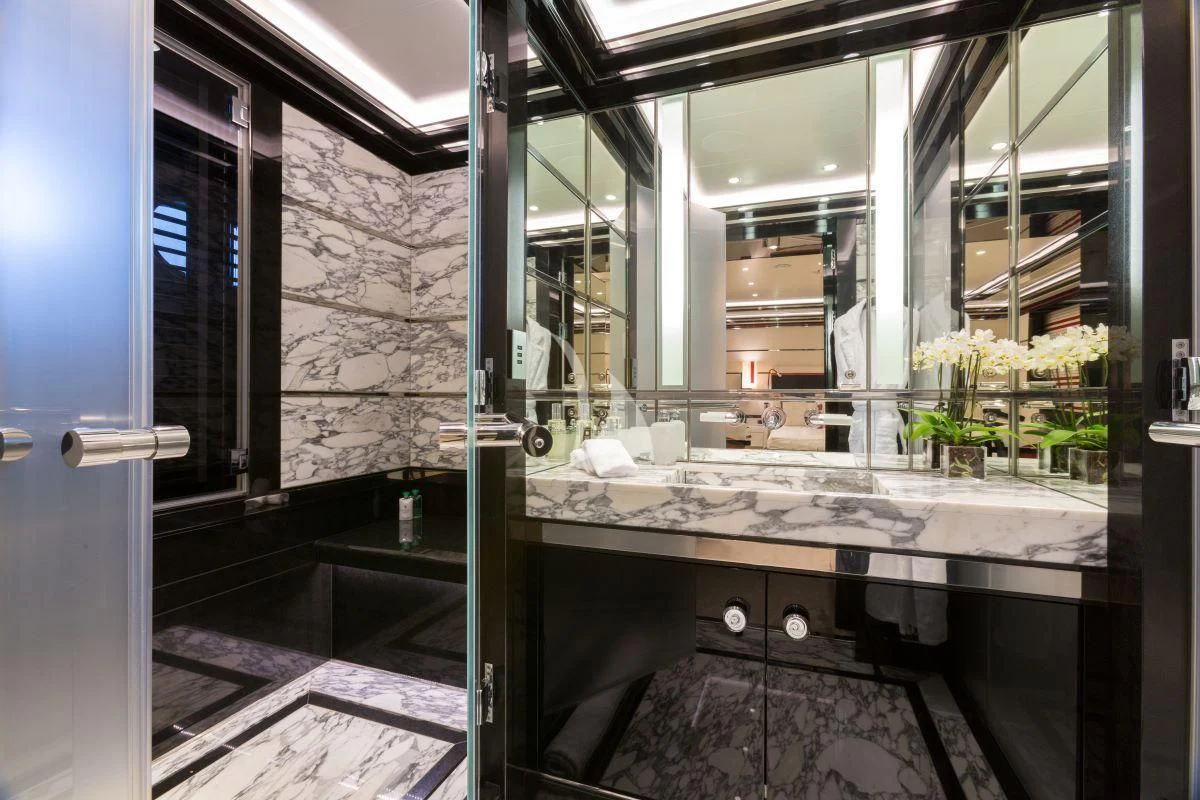 a bathroom with a large mirror aboard OKTO Yacht for Charter